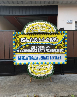 Papan Bunga Duka di Mila