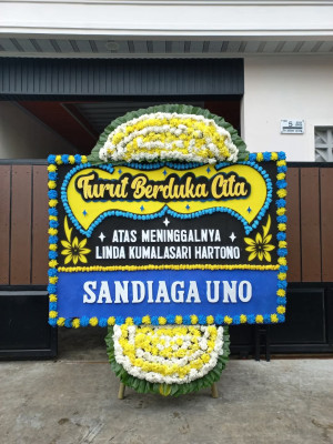 Papan Bunga Duka di Mila